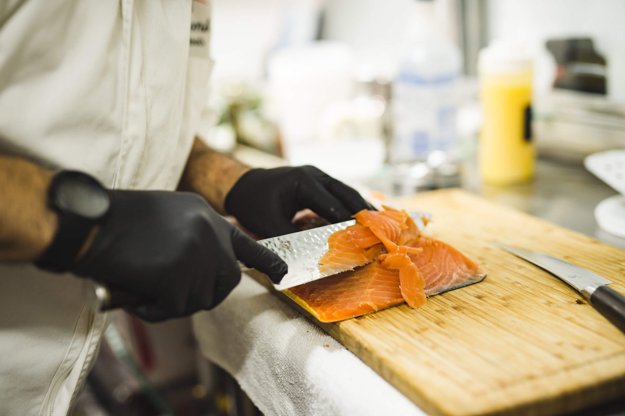 Chef Serge shaves smoked salmon for the Influencers Who Brunch Styled Shoot