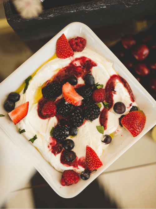 Yoghurt drizzled with honey and fresh berries