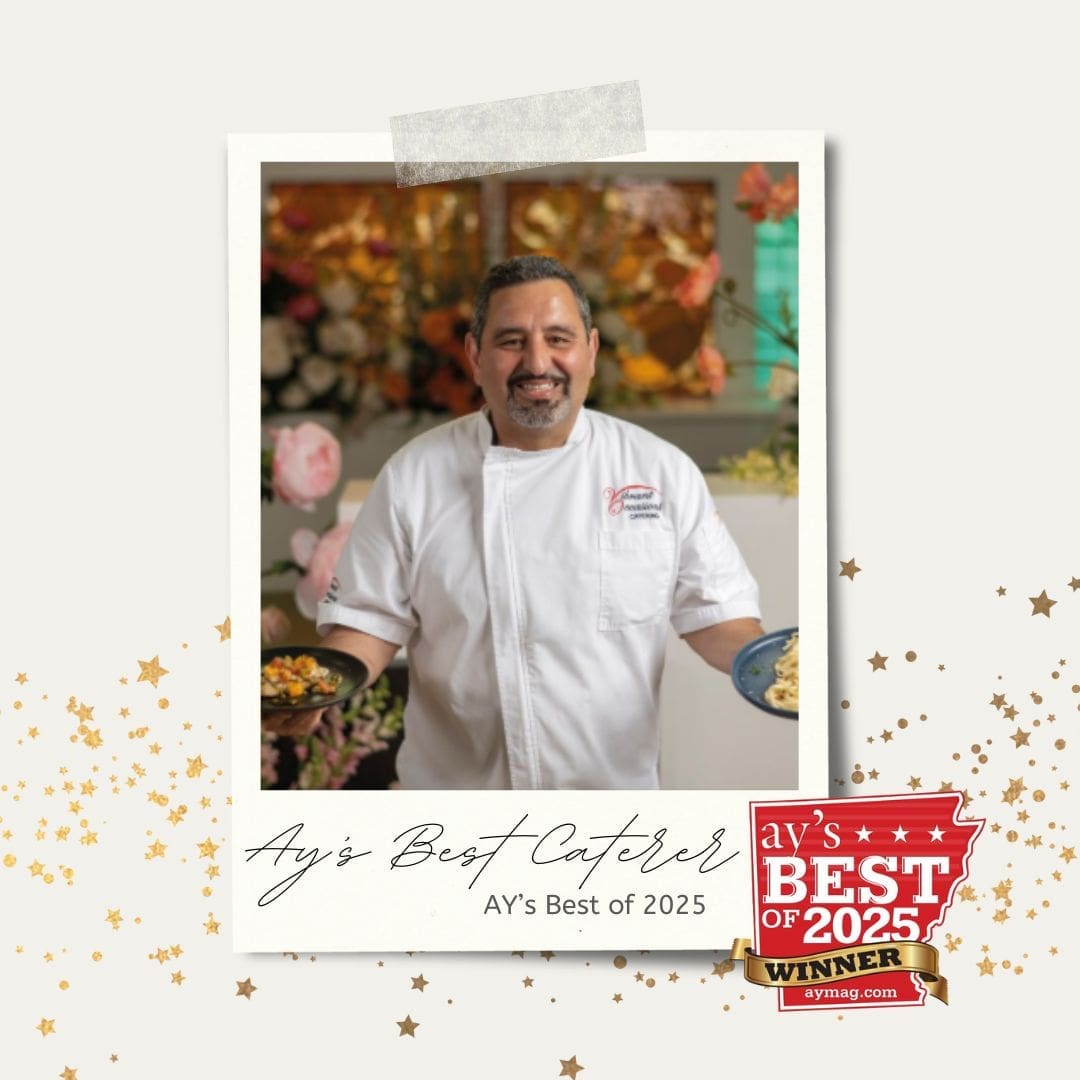 A smiling chef in a white uniform holds two plates of food. The image includes a AY’s Best of 2025 Winner badge and text that reads, Ay’s Best Caterer, AY’s Best of 2025. Gold confetti decorates the border.