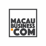 Macau Business Logo for Macau Business, featuring bold black text MACAU BUSINESS .COM inside a black square outline on a white background, with an orange dot before COM.